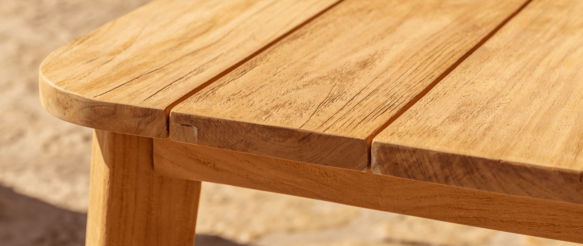 outdoor table showcasing the natural wood grain and texture, symbolizing sustainability and eco-friendly materials.
